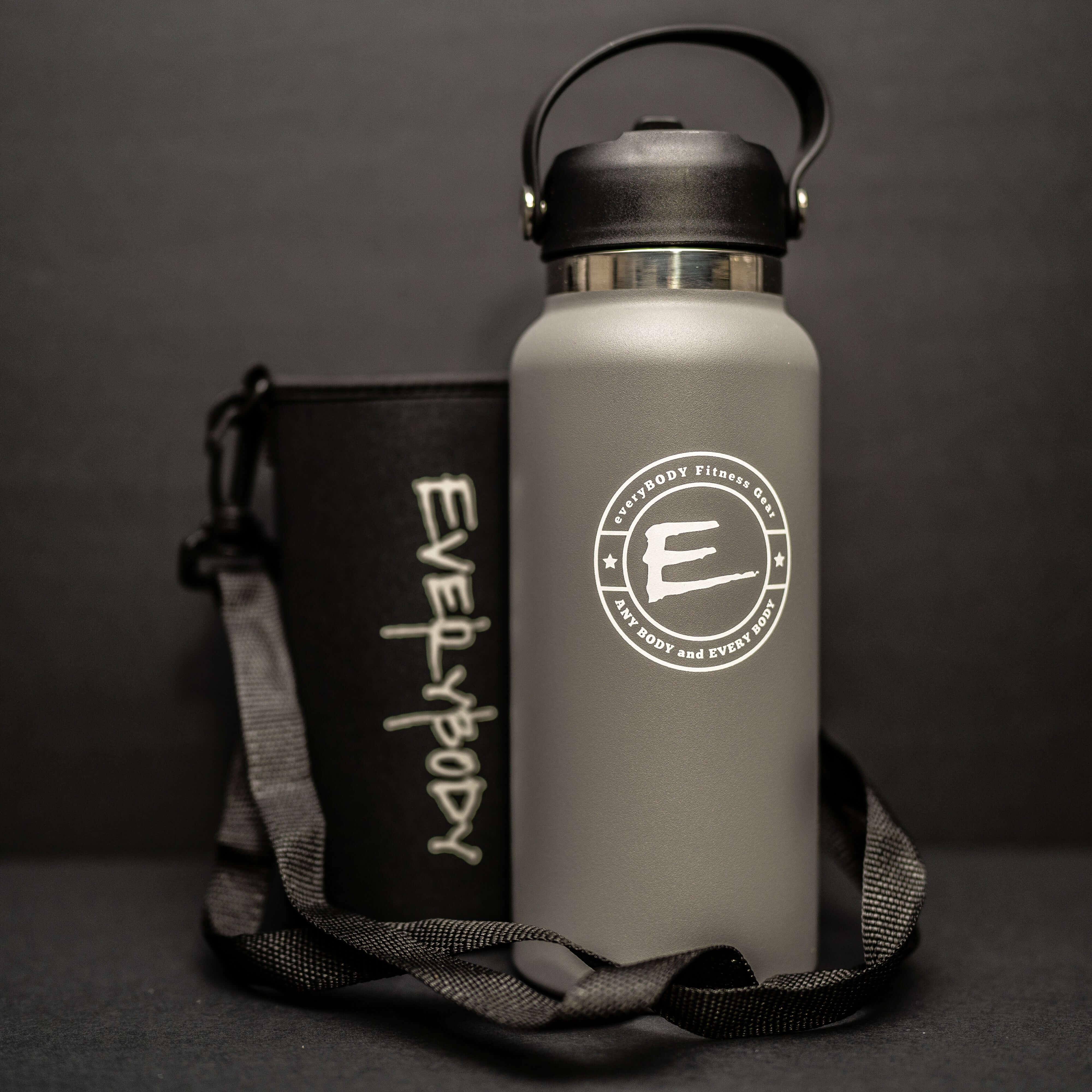 Light Gray Stainless Steel Water Bottle sitting against a textured background.