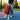 30L Red Backpack with Cup Holders being held on a basketball court.