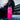 Hot Pink Stainless Steel Water Bottle sitting on a bench outside, showcasing the tough design.